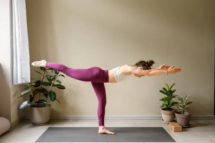 Achieving the Perfect Tone: How Often Should You Exercise for Results? 1 Woman doing Yoga exercise Brackley to help with toning the body.