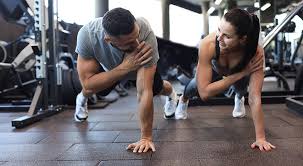 Sculpting Sleek Arms: The Essential Role of Cardio in Toning Without Bulking Up 1 Image of man and woman doing Cardio Brackley to tone their arms.